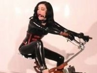 Svelte girl completely covered with latex having training